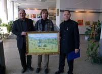 Микола Боровик дарує свою картину для палати, в які лікуватимуться во